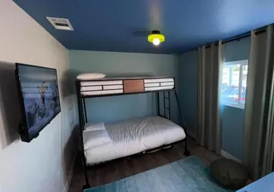 a small bedroom with a bunk bed in a room at MagicwayVillas Avetar Villa - 5 Bedroom 3 Bath - Spa and Splash Pad in Anaheim