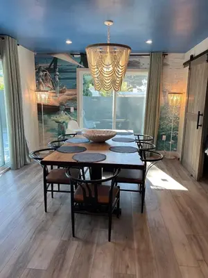 a dining room table with chairs and a chandelier at MagicwayVillas Avetar Villa - 5 Bedroom 3 Bath - Spa and Splash Pad in Anaheim