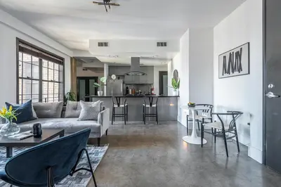 a living room with a couch and a table at Urban Luxe LOFT in Los Angeles