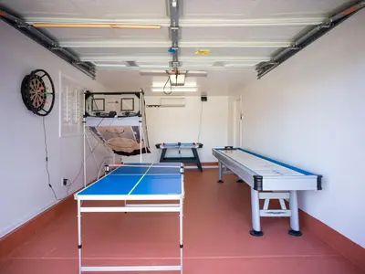 a room with a ping pong table in it at Fire Pit & Game Room 4 Beds Near Beach, LAX & SoFi in Lawndale