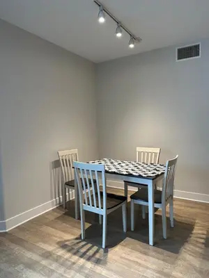 a dining room table and chairs in a room at Avalon Wilshire in Los Angeles