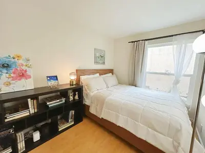a bedroom with a bed and a window at Brea Mall romantic two-bedroom house in Fullerton