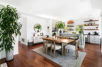 a kitchen and dining room with a table and chairs at Sun-Drenched Spanish Manor Home in Mar Vista in Los Angeles