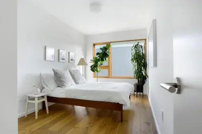 a white bedroom with a bed and a window at San Juan Featured in Architectural Digest Plus Sauna in Los Angeles