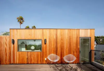 a house with two chairs on a deck at San Juan Featured in Architectural Digest Plus Sauna in Los Angeles