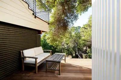 a chair and a table on a deck at Hillside Hideaway Guest House in Topanga Canyon in Topanga