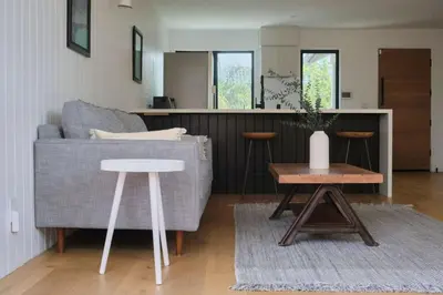 a living room with a couch and a table at Westminster Bungalow - Front House with Private Entrance in Los Angeles