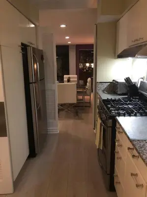 a kitchen with a refrigerator and a stove top oven at Best Location West LA Spacious condo with hottub in Los Angeles