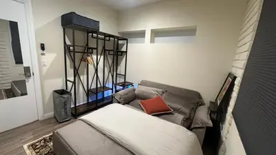 a living room with a couch and a chair at 2B2B quiet comfy home in Hacienda Heights