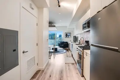 a kitchen with white walls and a hard wood floor at View of Hollywood Sign Studio, Free Parking in Los Angeles
