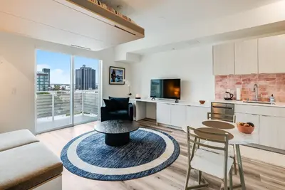 a kitchen and living room with a table and chairs at View of Hollywood Sign Studio, Free Parking in Los Angeles