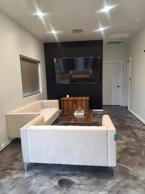 a living room with a couch and a flat screen tv at Azusa in Azusa
