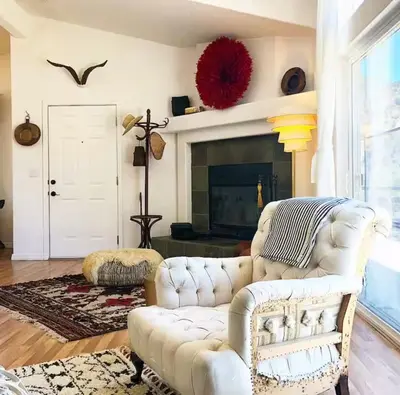 a living room with a white couch and a fireplace at Ojai Wilderness Off-The-Grid Sespe House in Ojai