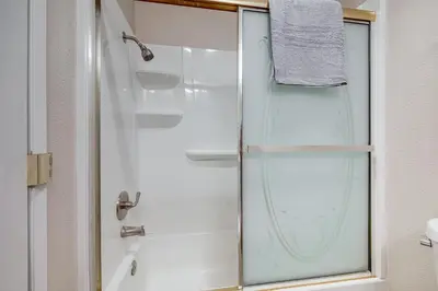a shower with a glass door in a bathroom at 2 Mi to Beaches Condo with Patio in Port Hueneme! in Port Hueneme