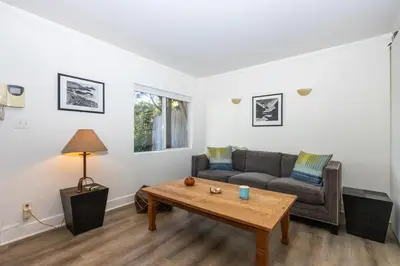 a living room with a couch and a coffee table at Walk to Melrose Ave - World Famous Shops and Restaurants in Los Angeles