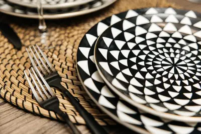 a table with plates and forks on a table at Signature One Bedroom Apartment in Los Angeles