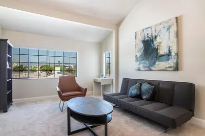 a living room with a couch and a table at Beautiful 6BR Family 2-Story Villa With Large Backyard and Outdoor Kitchen in Los Angeles