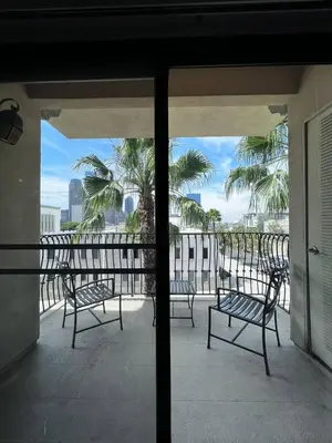 a balcony with chairs and a view of the ocean at ELEGANT RESORT-SoCal-Lux on 3rd in Los Angeles