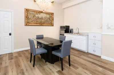 a kitchen with a dining room table and chairs at Spacious 2BR with Kitchenette and Dining in Beverly Hills in Los Angeles