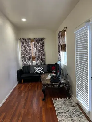 a living room with a couch and a table at Jacob Unit-C in Hawthorne
