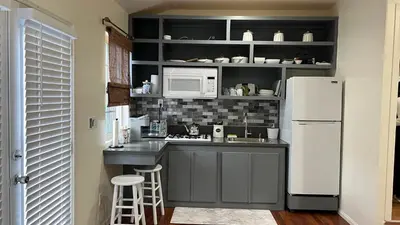 a kitchen with a white refrigerator and a microwave at Jacob Unit-C in Hawthorne