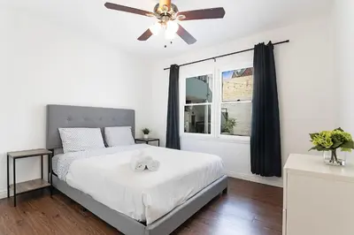 a bedroom with a bed with a ceiling fan at Ground-Floor 1-Bedroom by Beverly Hills Steps from Restaurants, Cafes and Shopping in Los Angeles