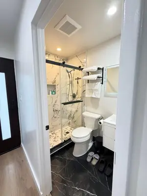 a bathroom with a toilet and a shower at Modern Studio Stylish &Cozy Ieft Unit in Los Angeles