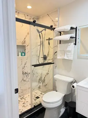 a bathroom with a toilet and a shower at Modern Studio Stylish &Cozy Ieft Unit in Los Angeles