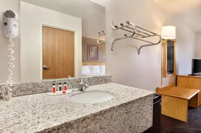 a bathroom with a sink in a hotel room at Travelodge by Wyndham Yermo in Yermo