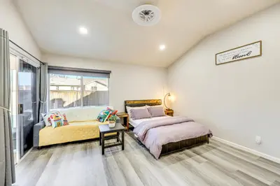 two beds in a room with a window at 10 Mi to Mojave Narrows Victorville Studio in Victorville