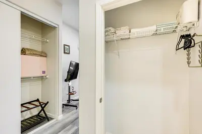 a room with a walk in closet with bunk beds at 10 Mi to Mojave Narrows Victorville Studio in Victorville