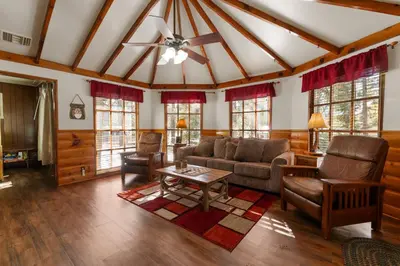 a living room with a couch and a table at Mountain Xscape - Hot Tub, Fireplace, Deck, Barbeque in Big Bear Lake