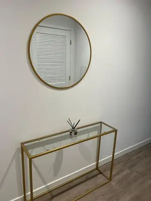 a mirror on a wall with a glass table at Santa Monica Bright Studio with stunning view in Los Angeles