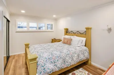a bedroom with a bed and a window at 10 Mi to Redondo Beach Carson Home with Pool Table! in Carson