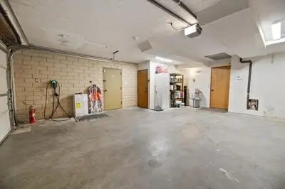 an empty room with a concrete floor and a brick wall at The Cedar Bear Lodge, Jacuzzi with an Outdoor Patio & BBQ in Big Bear City Airport
