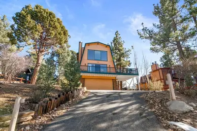 a house with a driveway in front of it at The Cedar Bear Lodge, Jacuzzi with an Outdoor Patio & BBQ in Big Bear City Airport