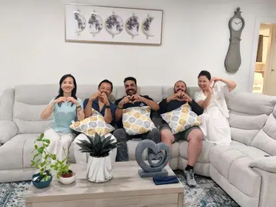 a group of people sitting on a couch at cozy house 4 bedrooms 2 baths in Glendora