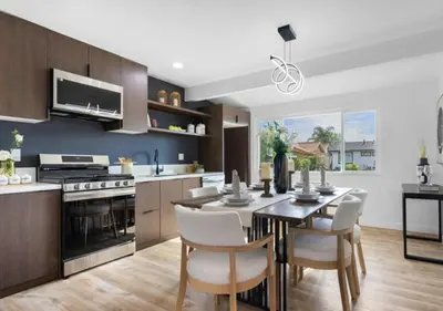 a kitchen and dining room with a table and chairs at cozy house 4 bedrooms 2 baths in Glendora