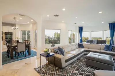 a living room with a couch and a dining room at Luxury Modern w/ Great LA Views in Woodland Hills