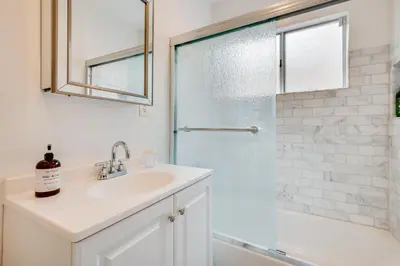a bathroom with a sink and a shower at 1 Mi to Dtwn Melrose Cozy Condo with Patio in Los Angeles