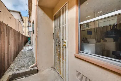 an entrance to a building with a window at 1 Mi to Dtwn Melrose Cozy Condo with Patio in Los Angeles