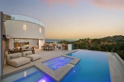 a house with a swimming pool and a living room at Woodhill Canyon in Los Angeles