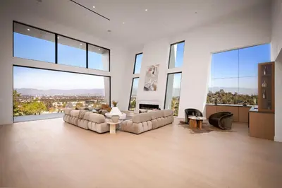 a large living room with couches and large windows at Woodhill Canyon in Los Angeles