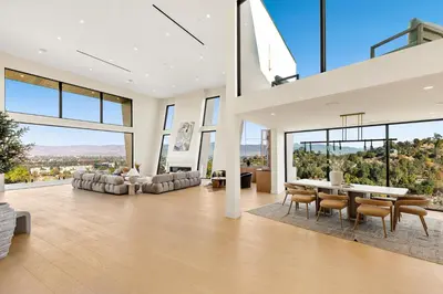 a large living room with a table and chairs at Woodhill Canyon in Los Angeles
