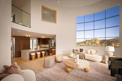 a living room with a couch and a table at Woodhill Canyon in Los Angeles