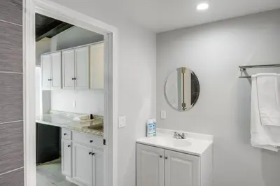 a white bathroom with a sink and a mirror at 6 Mi to Hiking Apartment in Frazier Park in Frazier Park