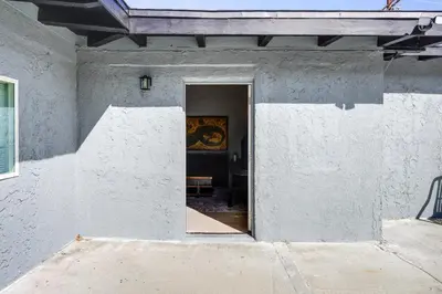 an open door into a white building at Hike and Explore Studio Stay in Frazier Park in Frazier Park