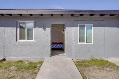 a white house with a door leading into it at Mountain Views Minimalist California Studio in Frazier Park