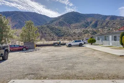 a car parked in a parking lot with mountains in the background at Mountain Views Minimalist California Studio in Frazier Park