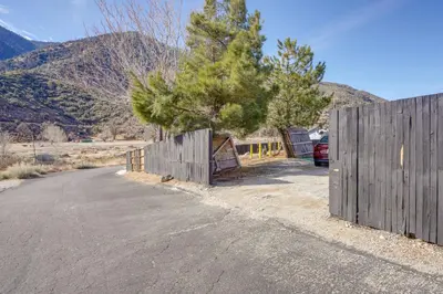 a wooden fence on the side of a road at Mountain Views Minimalist California Studio in Frazier Park